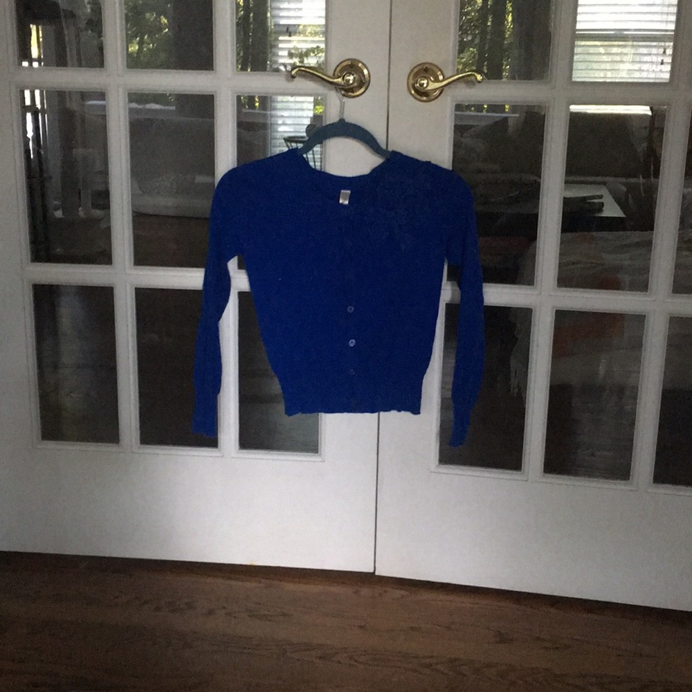A blue cardigan